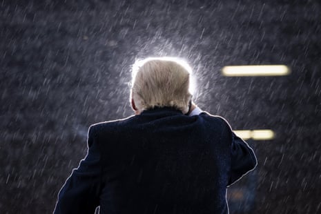 A man speaks in the rain