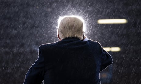 A man speaks in the rain