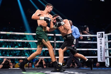 Sebastian Fundora, left, trades blows with Tim Tszyu during their fight.