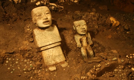 The two standing statues discovered in the tunnel.