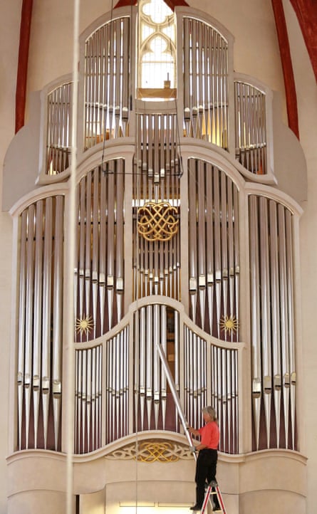 One of the 4267 pipes of the organ at St Thomas Church in Leipzig, Germany, where JS Bach was cantor, being taken out for cleaning.