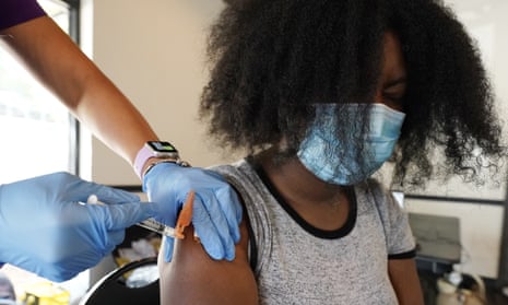 A student receives the Pfizer Covid-19 vaccine in Jackson, Mississippi on 21 September 2021.