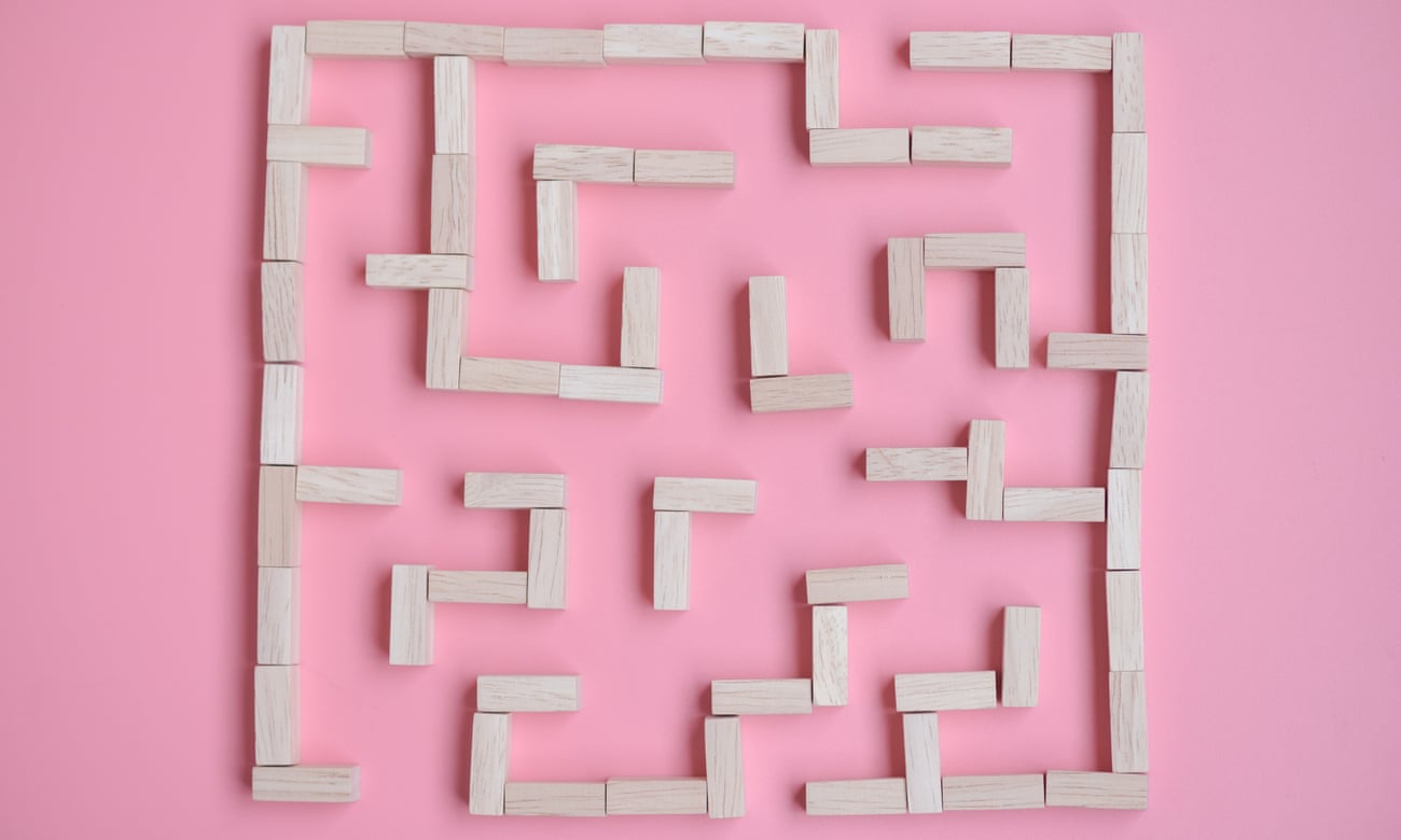 maze of wooden blocks on a pink background