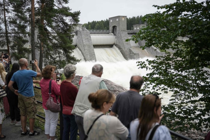 Tourists gather on the bridge over the Vuoksi river near The Imatra Rapids in Imatra, Finland, on 12 August, 2022.