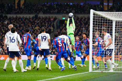 Crystal Palace goalkeeper Dean Henderson (centre) catches the ball in the air from a corner kick.