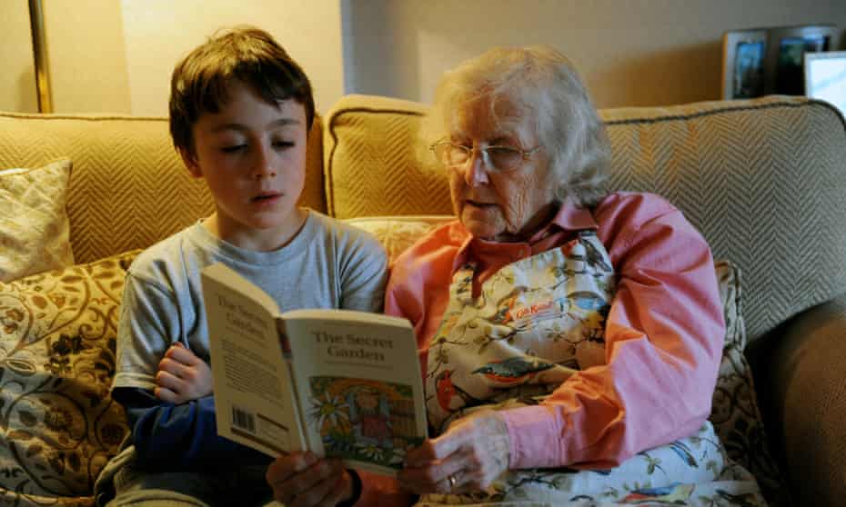 Child reading to an adult