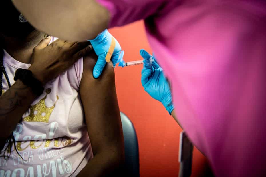 RaShunda St. George, of the Prime Care Medical Center, administers a dose of the Moderna COVID-19 Vaccine for patient in Tuskegee, Alabama on Thursday, May 20, 2021.