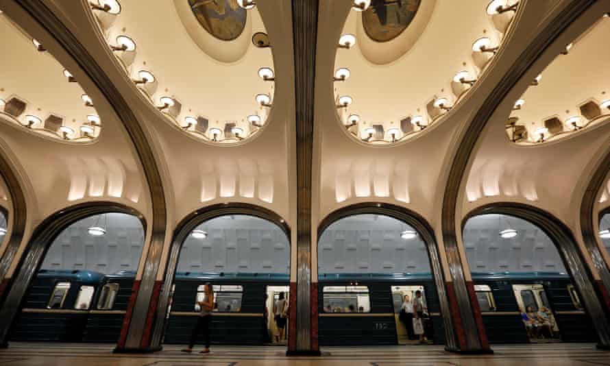 A woman walks on the platform as a train arrives at Mayakovskaya metro station, which was built in 1938, in Moscow August 17, 2013. The Moscow metro was opened in 1935, and carries more passengers daily than the London and New York metro systems combined.