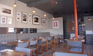 Prints and photos adorn the walls of the Wuff bistro, in Dublin's Stoneybatter neighbourhood