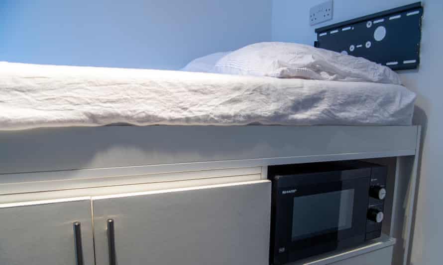 The bed, microwave and storage