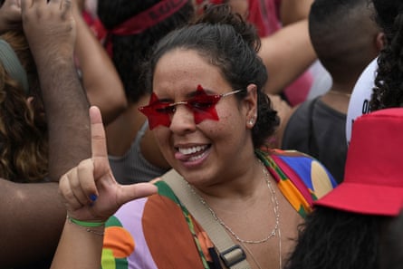 A supporter of former Brazilian President Luis Inacio Lula da Silva, flashing the letter L for 
