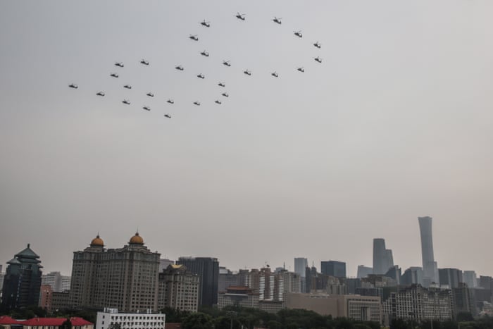 Aircraft fly in formation during a parade marking the 100th founding anniversary of the Chinese Communist Party, in Beijing, China, 01 July 2021.