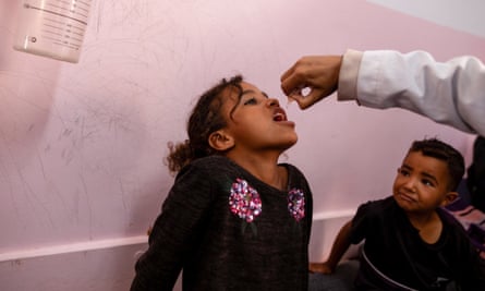 A nurse administers a polio vaccine in Khan Yunis in the southern Gaza Strip on Saturday.