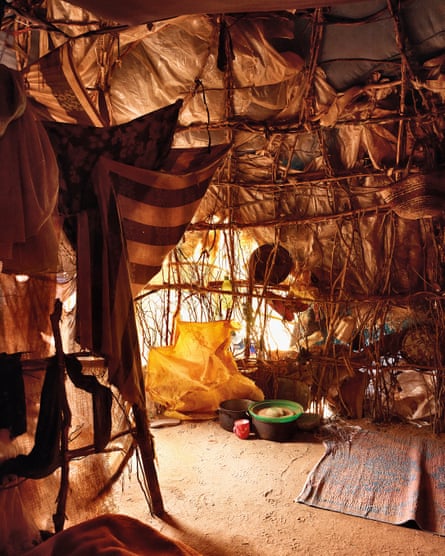 The dimly lit interior of a tent-like dwelling