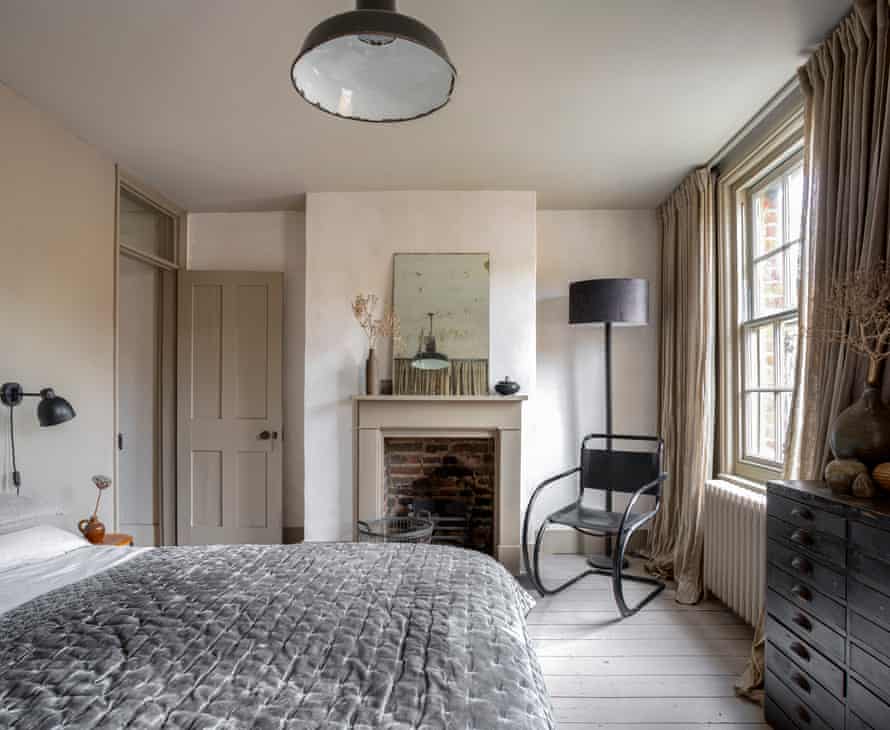 Sleep on it: one of the top-floor bedrooms, which is rented out to guests. The Mies van der Rohe cantilever chair (one of a pair) is unusual for its black (rather than chrome) frame.