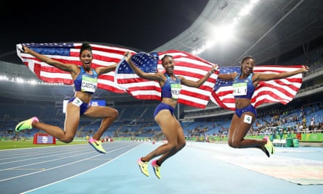 Bronze medallist Kristi Castlin, gold medallist Brianna Rollins and silver medallist Nia Ali of the United States celebrate after the 100m hurdles final.