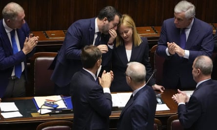 Italian prime minister Giorgia Meloni talks to infrastructures minister Matteo Salvini after addressing the lower Chamber ahead of a confidence vote for her Cabinet on 23 October