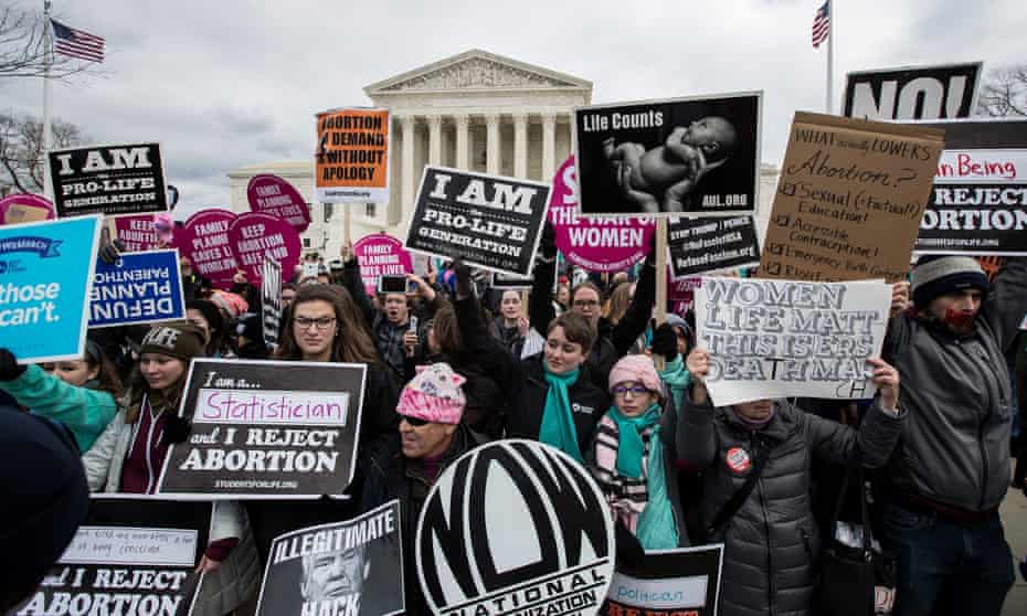 Anti-abortion and pro-choice advocates rally outside the US supreme court on the 44th anniversary of Roe v Wade.