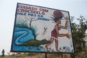 In many remote communities in Mozambique, a river may be the only source of water for people. This sign warns people about crocodiles when working near water