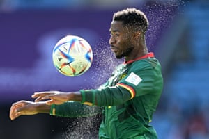 Cameroon’s Martin Hongla is pictured controlling a rather wet ball against Switzerland