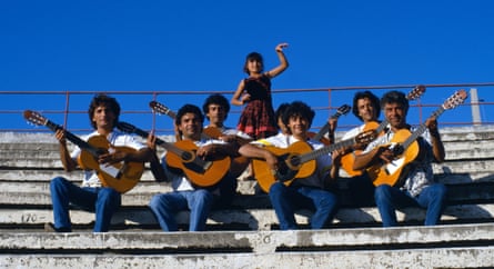 Gipsy Kings with guitars and a small girl posing in flamenco costume