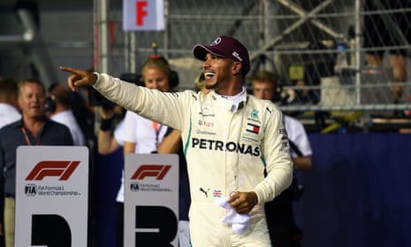 Lewis Hamilton gestures to the crowd after claiming pole at the Singapore F1 grand prix at Marina Bay