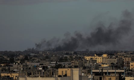 Smoke rises across the city after Israeli airstrikes in Khan Younis