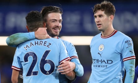 Jack Grealish (centre) celebrates with Riyad Mahrez and John Stones after Manchester City 1-0 victory at Chelsea.