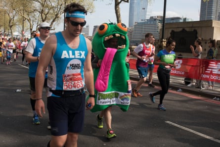 Participants in the 2018 London Marathon. To left a man in a vest saying ALEX and to his right a runner in fancy dress