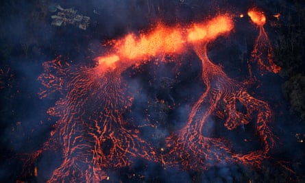 A fissure eruption fountains more than 200ft into the air, consuming all in its path, near Pahoa.