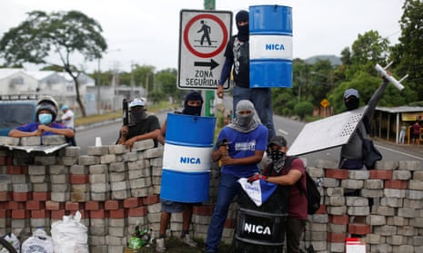 Demonstrators stand at a barricade during a protest against Daniel Ortega’s government in Nindirí, Nicaragua, on 5 June.