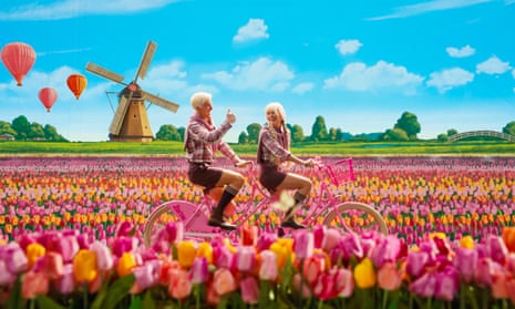 A detail from the Barbie film starring Margot Robbie and Ryan Gosling in which their characters cycle past Dutch tulips and windmill.