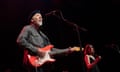 Richard Thompson wth a guitar singing on stage at York Barbican