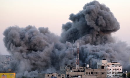 Plumes of smoke rise above Rafah after an Israeli airstrike on Sunday