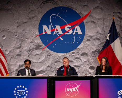 Three people side by side at a table.