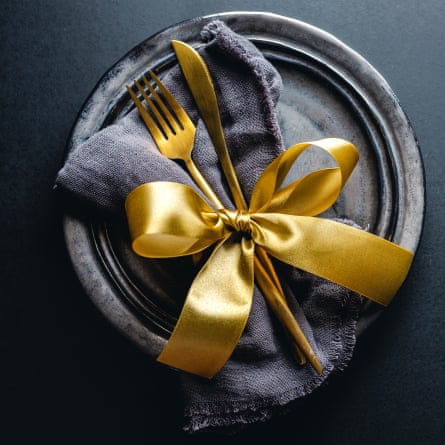 Looping bows around folded napkins and plates.