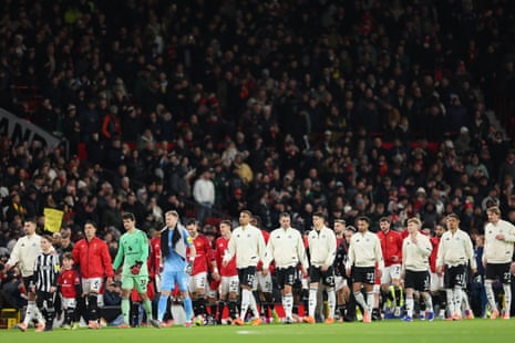 The Manchester United and Newcastle players take to the pitch ahead of their Boxing Day Premier League match.