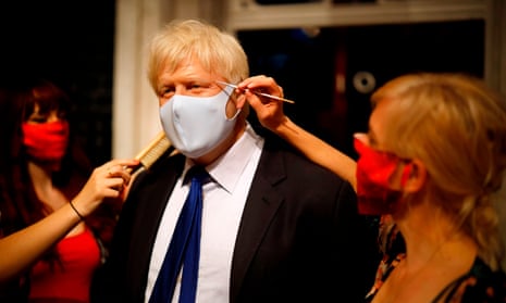 Artists put the finishing touches to a wax figure of Boris Johnson at Madame Tussauds in London ahead of its reopening on Saturday.