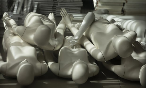 Mannequins lie on the floor in a closed clothing store in London