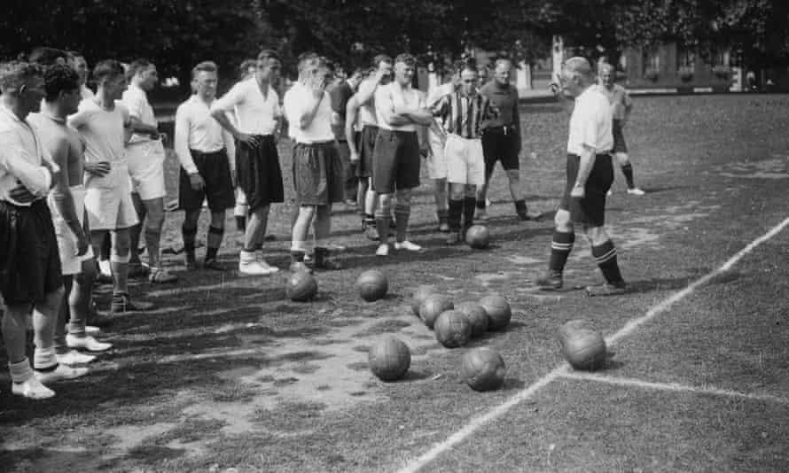 Jimmy Hogan, then Aston Villa’s manager, addresses his squad in August 1936.