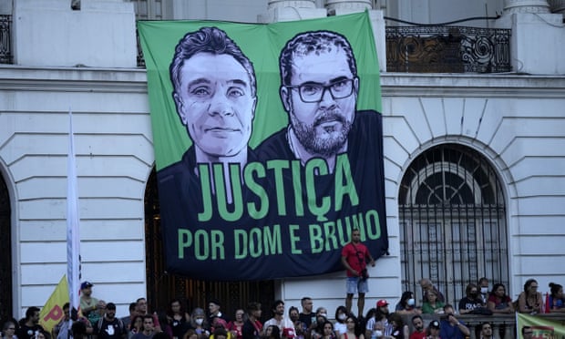 Protesters in Rio de Janeiro with a banner calling for justice for the murders of Bruno Pereira and Dom Phillips