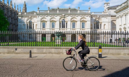 A woman cycling in Cambridge