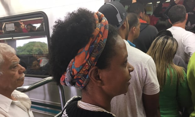 No room to get in … Alcione Santos tries to board the metro.