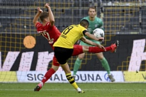 Borussia Dortmund’s Mahmoud Dahoud fires a shot past Bayern Munich’s Joshua Kimmich,