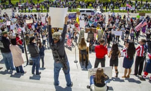 Several hundred people attend a ‘Stand for Freedom’ protest against – and in violation of – Idaho Governor Brad Little’s stay home order during the coronavirus pandemic in Boise, Idaho Friday.