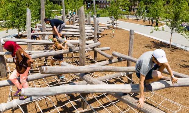 people climb on play structure on governor's island