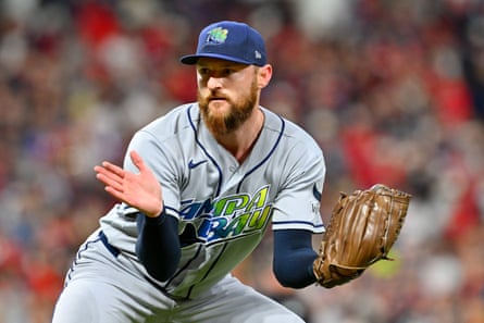 Rays pitcher Bryan Baker celebrates after recording the final out of Sunday’s 3-1 win over the Guardians in Game 5 of the American League Championship Series in Cleveland.
