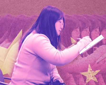 An image of a Chinese woman with long hair and glasses writing in a book