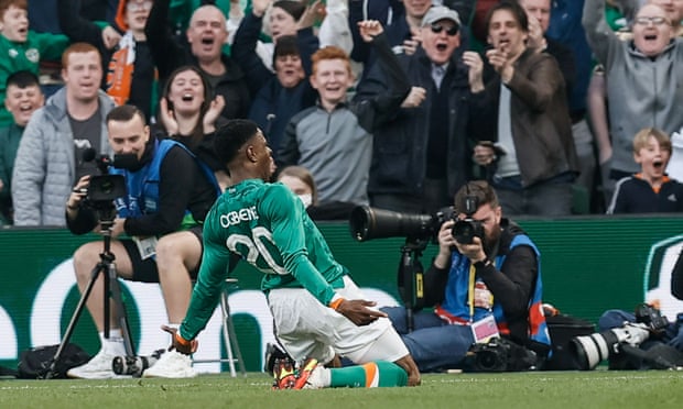 Chiedozie Ogbene knee slides in front of the Irish fans