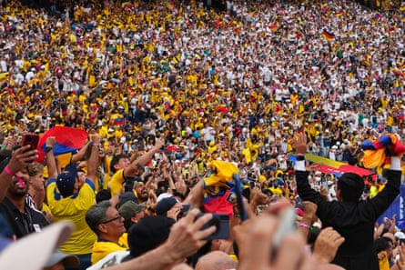 people cheering in a stadium